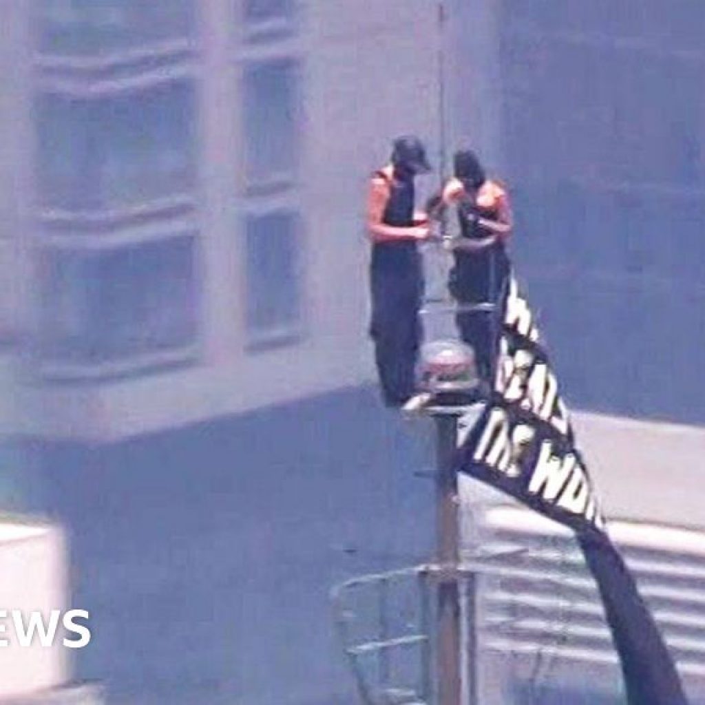 Watch: Two people climb to highest point of Empire State
Building