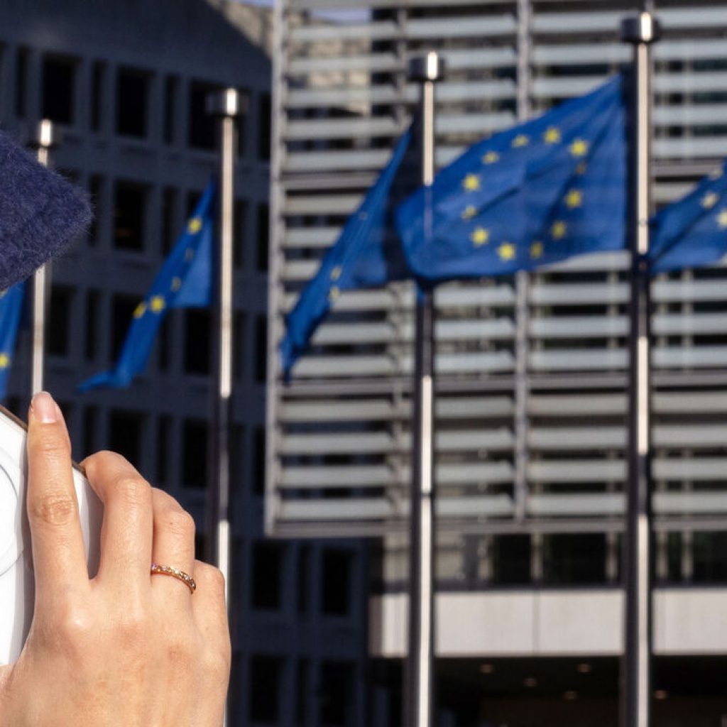 High government debt makes a common European safe asset unlikely A woman talks through an iPhone at the Berlaymont building, headquarters of the European Commission, in Brussels.