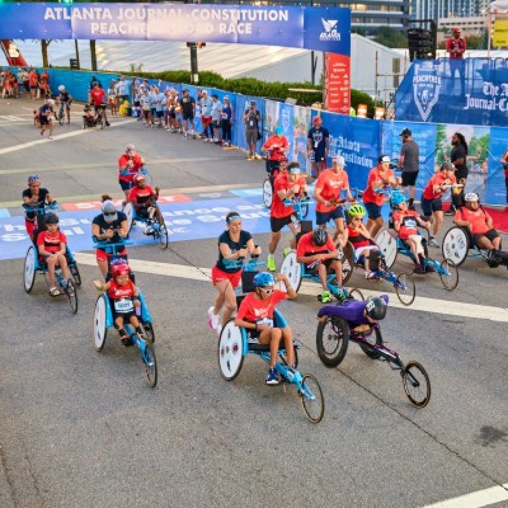 The Kyle Pease Foundation push teams tackle the heat, hills,
and humidity at the Peachtree Road Race