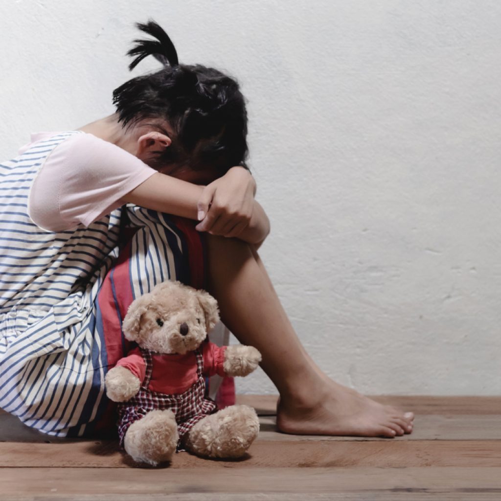 Age at which childhood abuse occurs is associated with distinct brain activity in adulthood