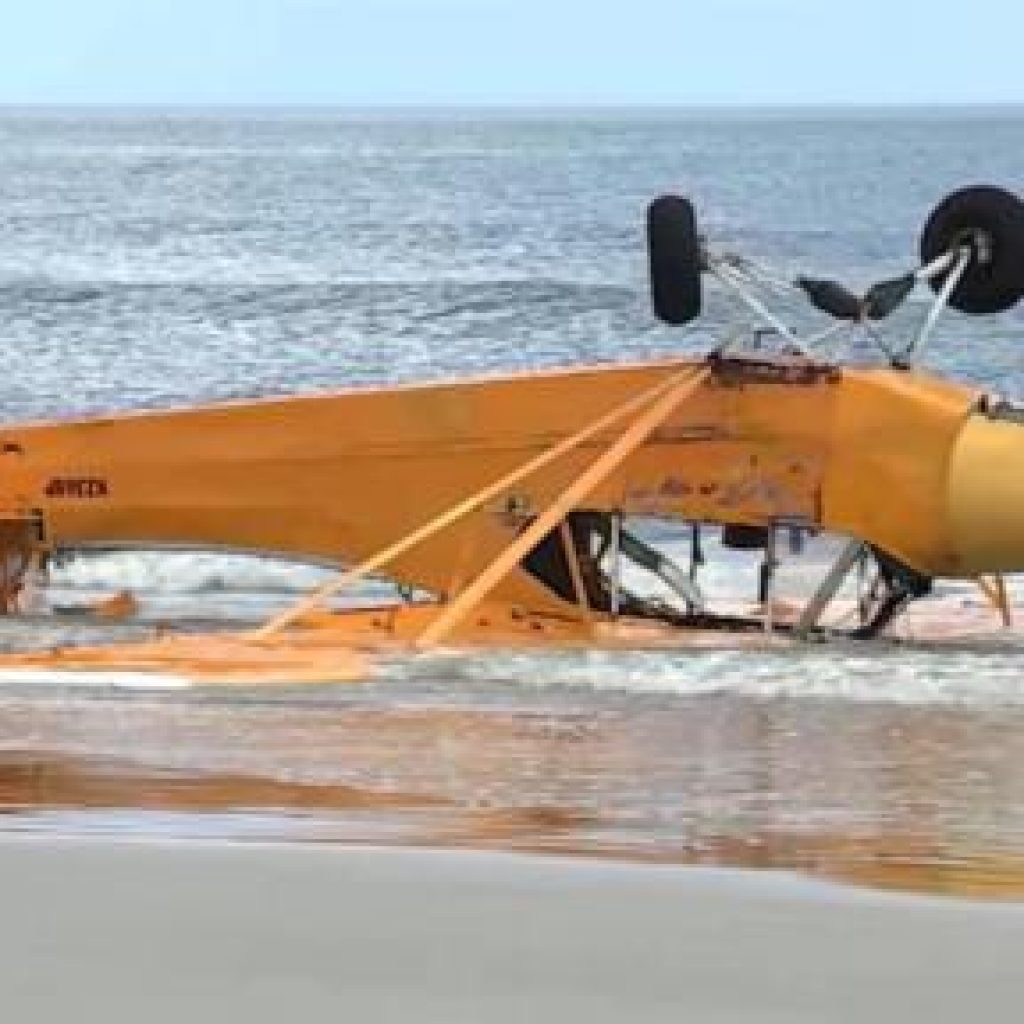 WATCH: Pilot rescued after banner plane crashes into Florida
surf