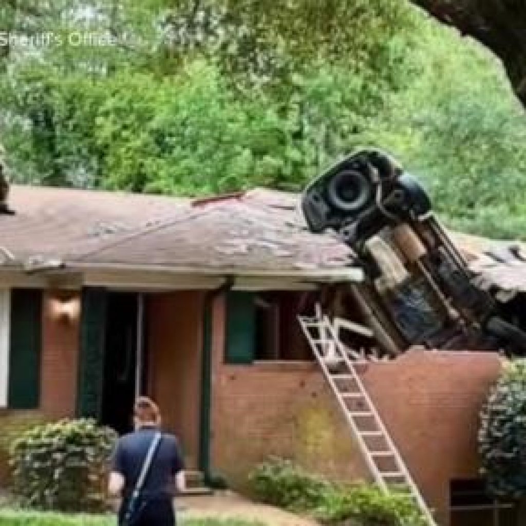 WATCH: Car lands on Georgia home in deadly crash