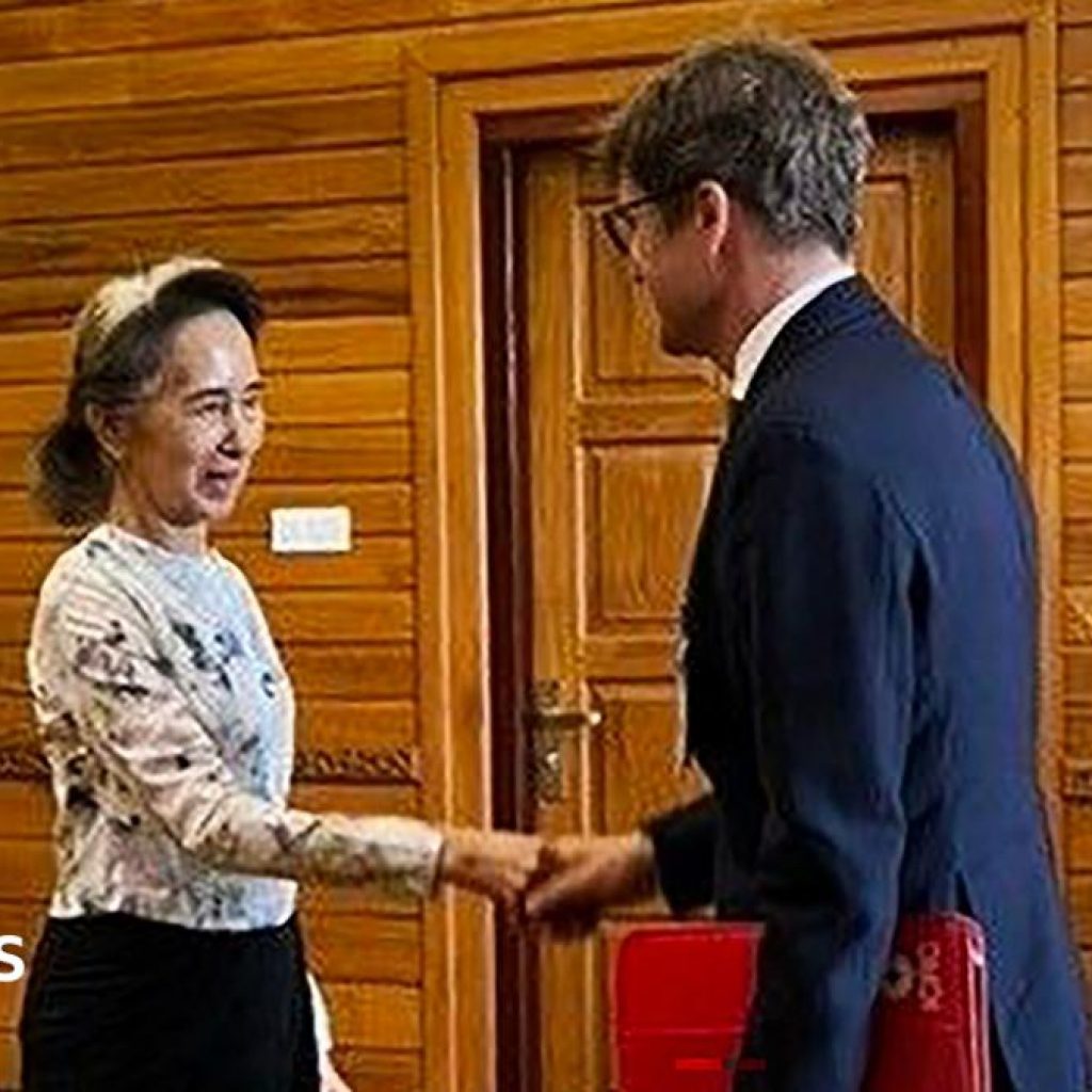 Aung San Suu Kyi appears healthy in first confirmed outside
contact for 2.5 years