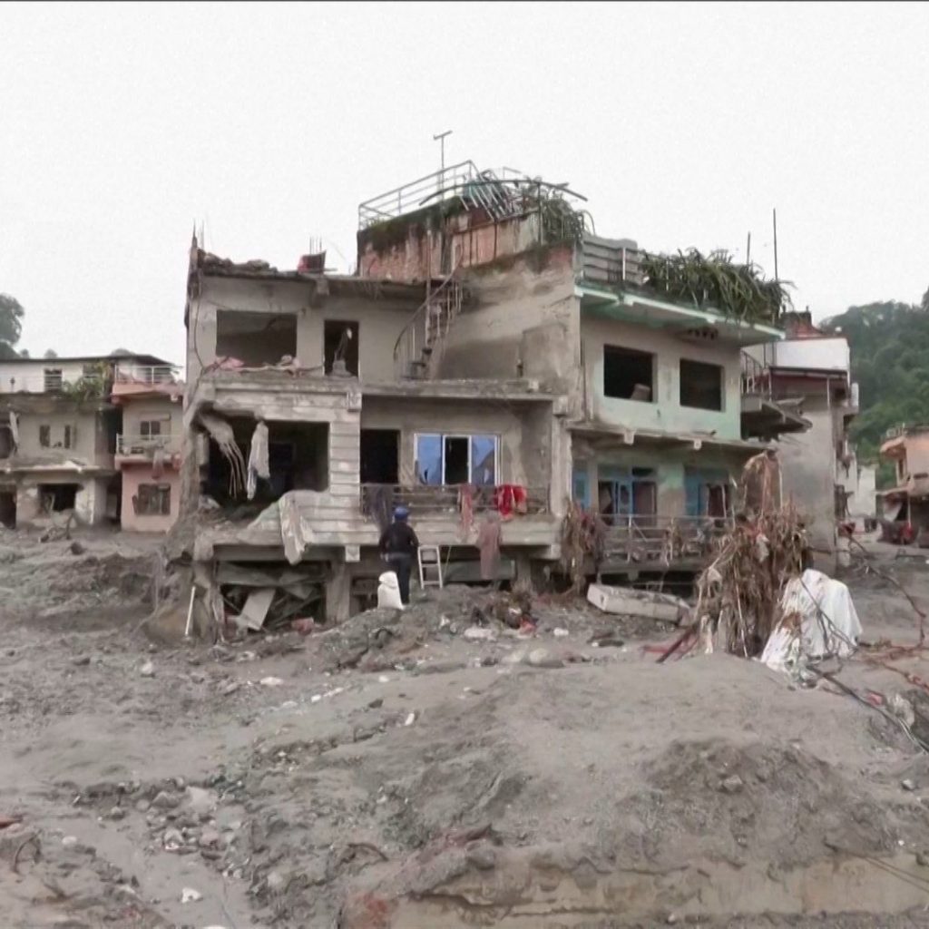 People return to their flood-ravaged homes in Nepal