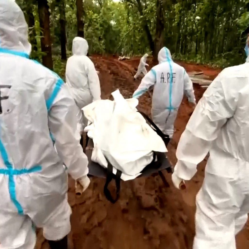 Nepal buries unidentified flood victims as families await
answers
