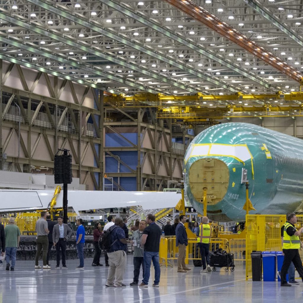 Boeing narrows third-quarter loss as defense sales rise, but
focus remains on 737 Max production