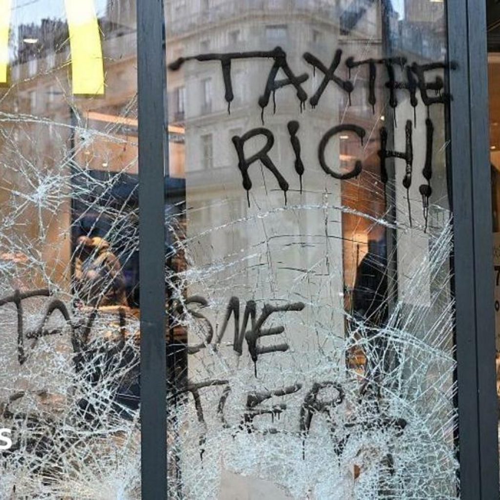 Burnt out cars and shattered glass on Paris streets after
protests turn to riots and looting