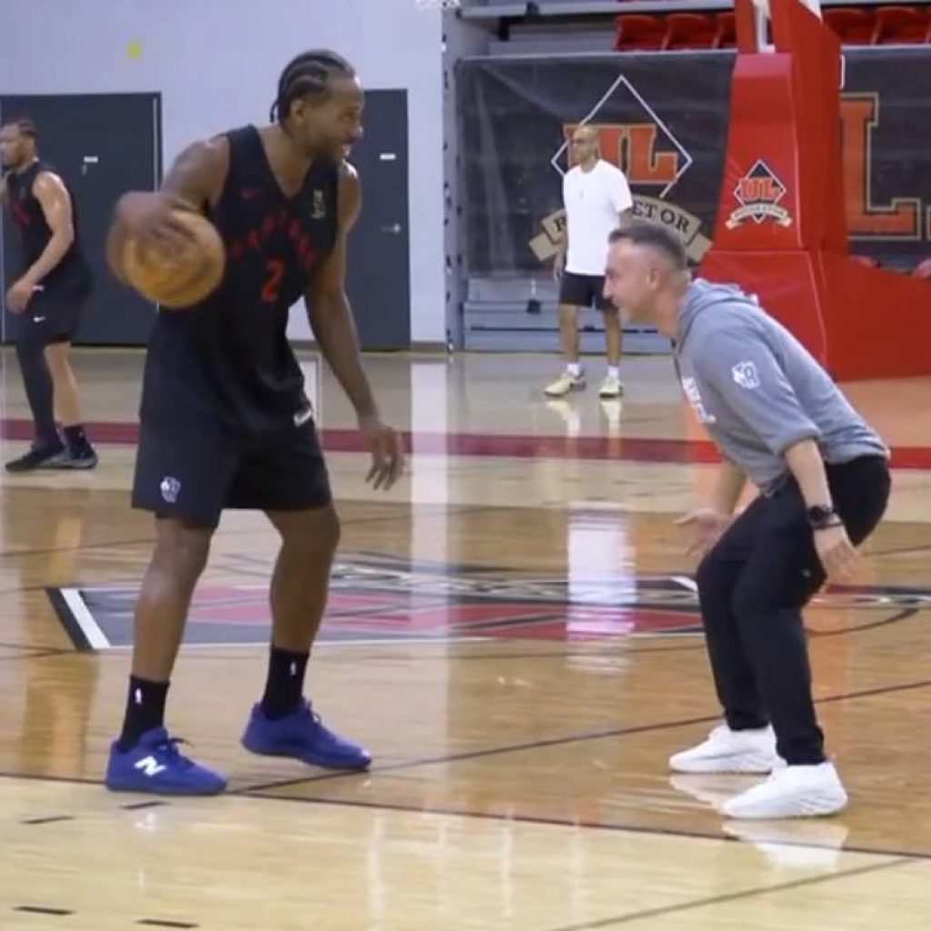 Raptors’ Leonard, head coach Rajakovic play friendly 1-on-1
at camp