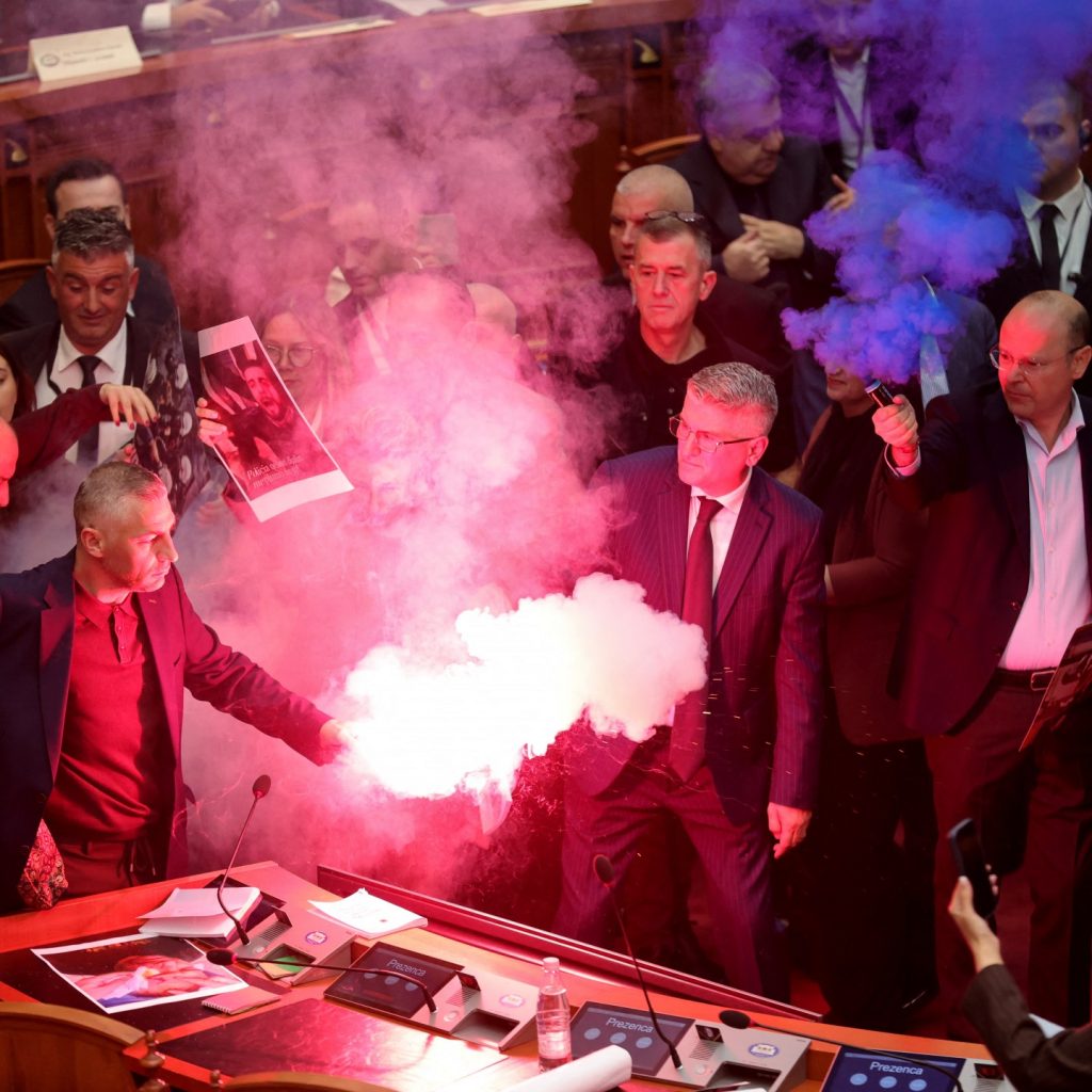 Albanian opposition storms parliament, sets off flares and
smoke bombs