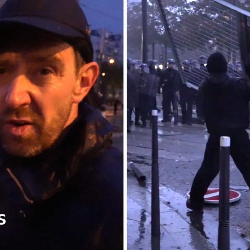 Fireworks and tear gas as protesters and riot police clash
in Paris