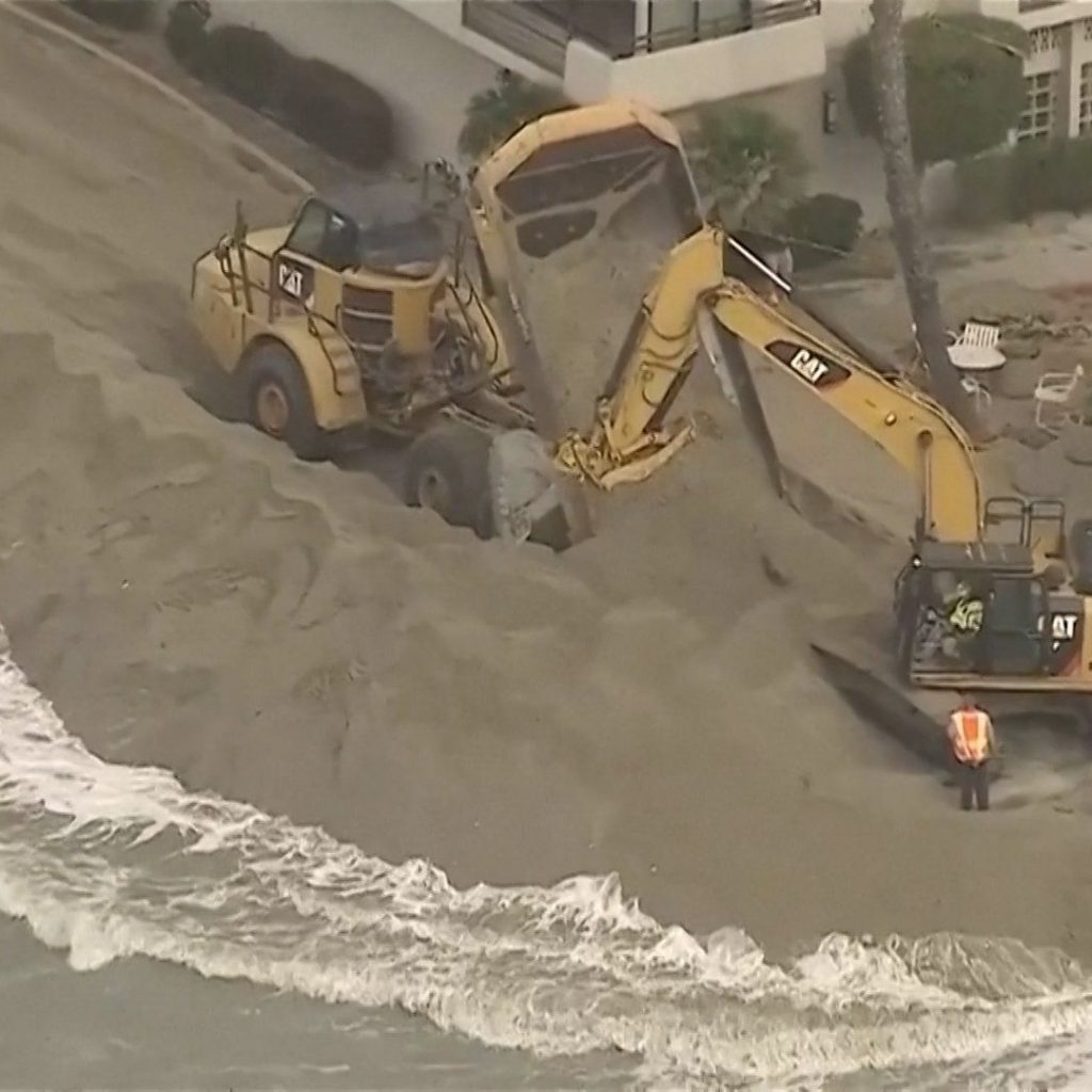 Waves crash into homes as excavators try to protect
California properties