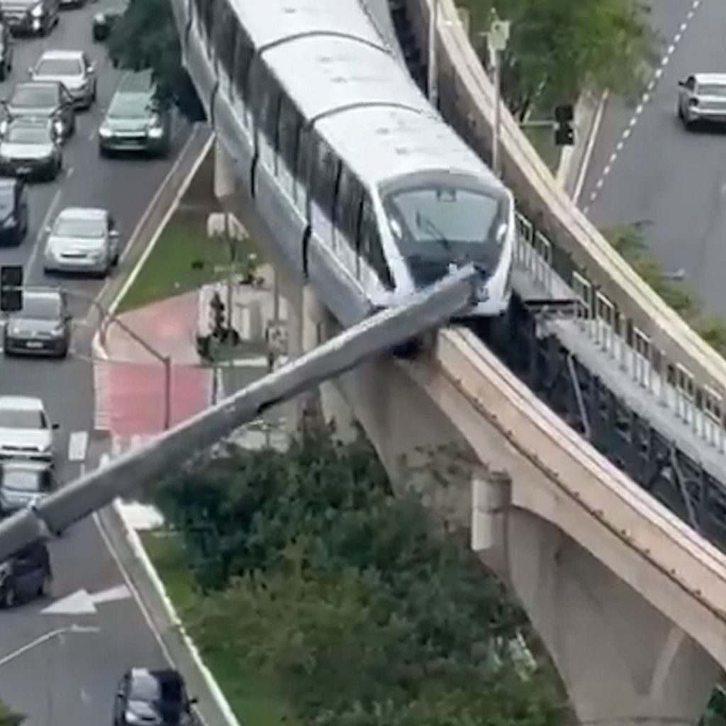 Train slams into crane that collapsed onto railway line in
Brazil