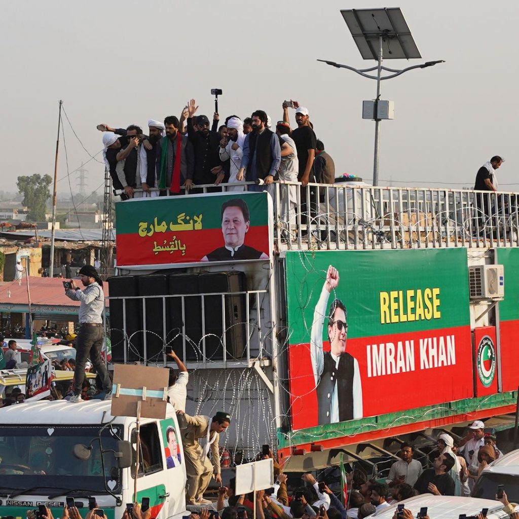Thousands of Imran Khan supporters march towards Pakistan’s
barricaded capital