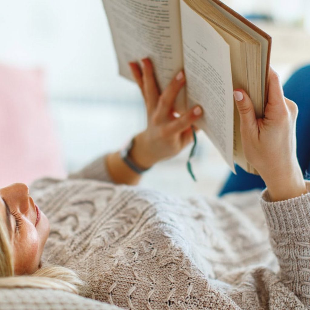 Learning to read may shape how adults reason about what others believe